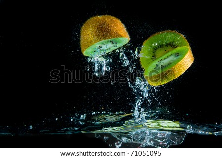kiwi fruit splashing in the water