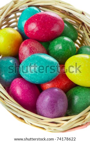 colorful easter eggs in basket isolated