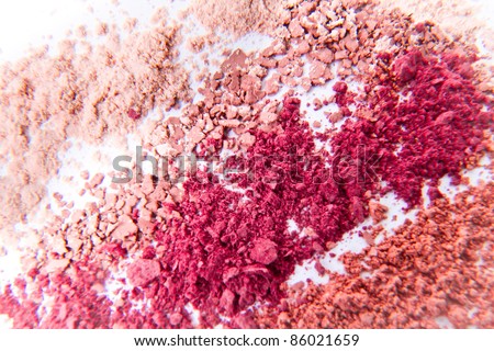 makeup powder in three colors on white background