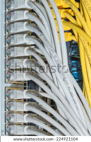 network cables connected to switch - closeup of data center hardware