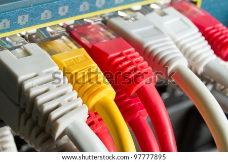 close up of network cables connected to switch