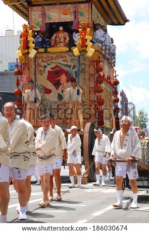 KYOTO-JULY 17: Procession of traditionally clothed people and big floats during Gion Festival (Gion Matsuri) on July 17 2010 in Kyoto, Japan. Gion festival is one of the most famous festivals in Japan