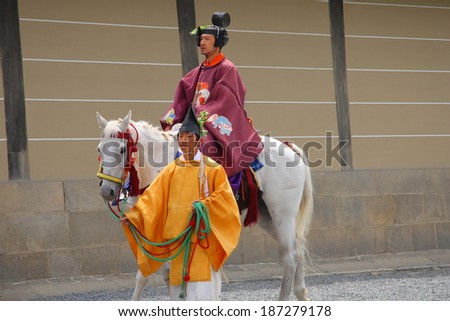 KYOTO-MAY 15: Participant of Aoi Matsuri in samurai clothes riding horse along imperial palace to pray for an abundant harvest on May 15, 2009 in Kyoto, Japan. This festival was started in 6th century