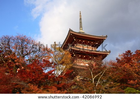 Famous pagoda of Kiyumizu Dera temple in autumn with a grey and blue sky(Kyoto, Japan)
