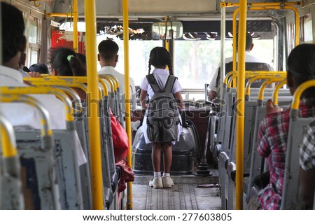 Young sri lankan girl going to school by bus