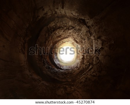 Mysterious tunnel to the light. May symbolise way to heaven after death.