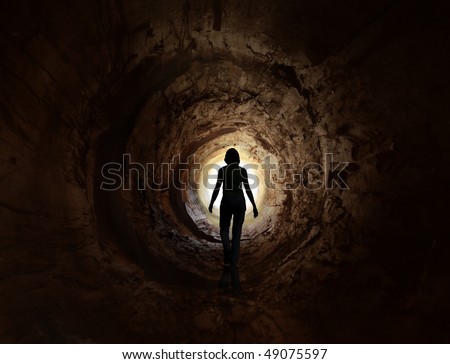 Walk into the light in the dark tunnel. May symbolise escape, looking for exit or freedom and even death or clinical death.