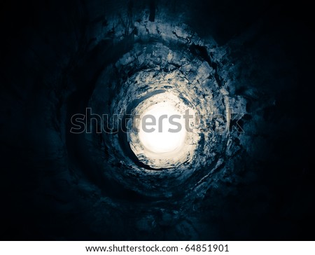 Dark-blue tunnel leading to the rotating light. May symbolise way to heaven after death, clinical death, escape, exit, freedom, psychedelic vision or some frame from the SF movie.