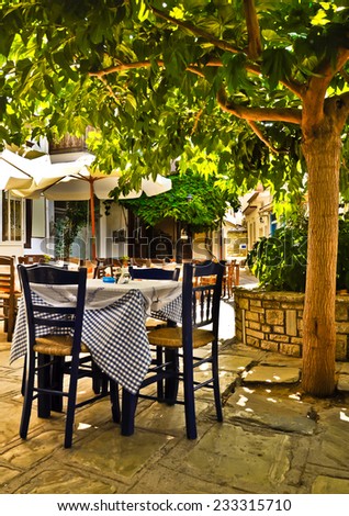 Romantic restaurant under the tree. Vourliotes village main square, Samos, Greece.