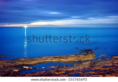 Lighthouse at dusk, in a long time exposure (England)