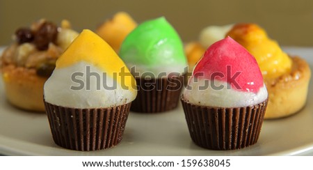 Variety of muffin type fairy cakes, cup cakes and fresh fruit cakes