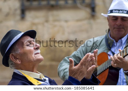 MALAGA, SPAIN - APRIL 29: Two men playing spanish guitar and singing flamenco music in the streets, on April 29, 2009, in Malaga, Spain.