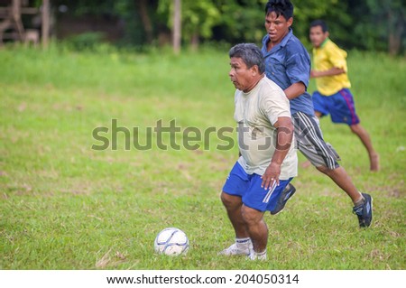 LORETO, PERU - JANUARY 02: Unidentified locals playing football in a small village in the middle of the Amazon Rain Forest, on January 02, 2010 in Loreto, Peru.