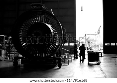 Front view of jet engine removed from aircraft (airplane) for maintenance and service all part and component .Jet engine maintenance at aircraft hangar by aircraft technician for safety.