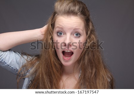 Beautiful commercial portrait of a woman doing funny faces