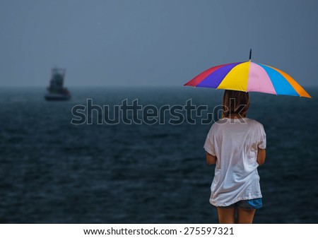 Woman and umbrella lonely in rain day