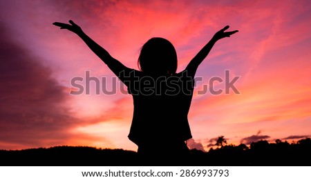 woman freedom on twilight background