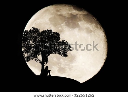 Silhouette woman sad on full moon background