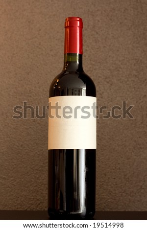 Red wine bottle with empty label to put your text on