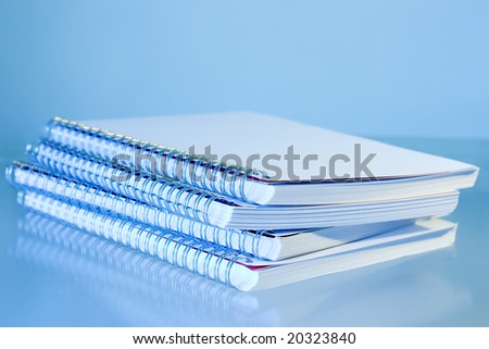 Spiral notepads on a pile - Blue filter