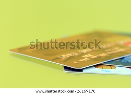 Credit cards on green background. Focus on foreground