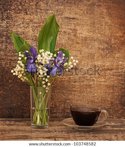 Still-life bouquet of lily of the valley  with blue irises