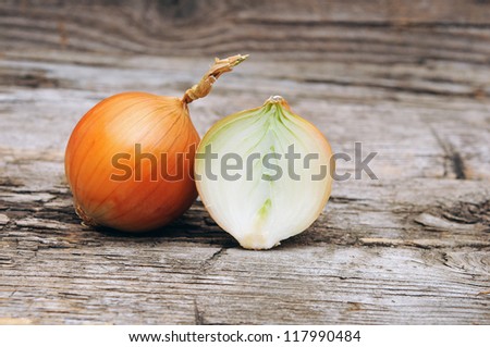 organic onions on wooden background