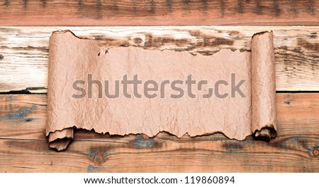 Paper scroll on wooden table