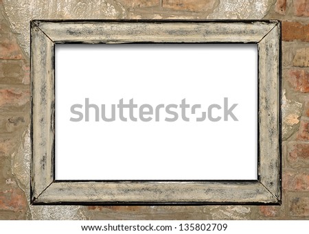 old frame on brick wall