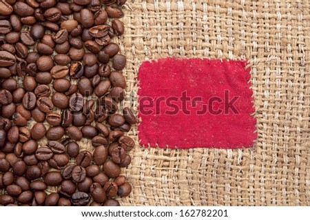 coffee beans on old canvas with red patch
