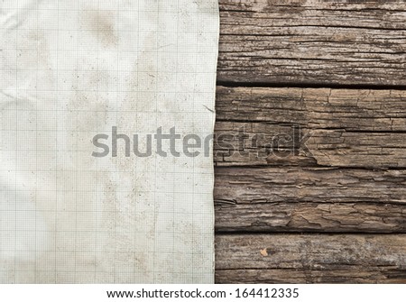 vintage sheet of graph paper border old wood background