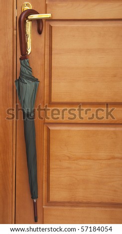umbrella on the handle of entrance door