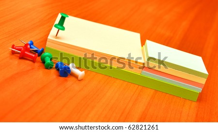 pile colored note papers and office accessories