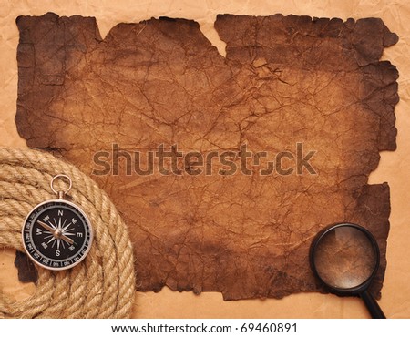 rope coil with compass on very old paper