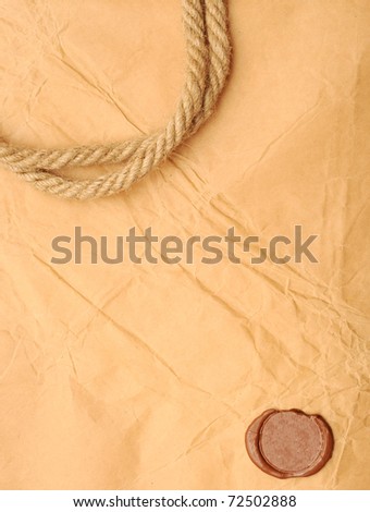 seal wax and rope on old paper background