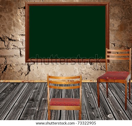 photo of abstract grunge shabby interior with school blackboard and two chairs