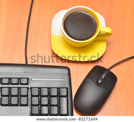 computer mouse, black keyboard and coffee cup