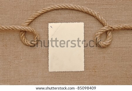 Old vintage photo with a rope on brown canvas background