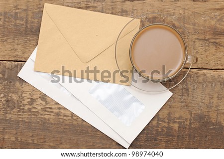 envelopes with black pen on wood background