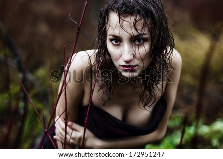 Wild woman\'s face under rain