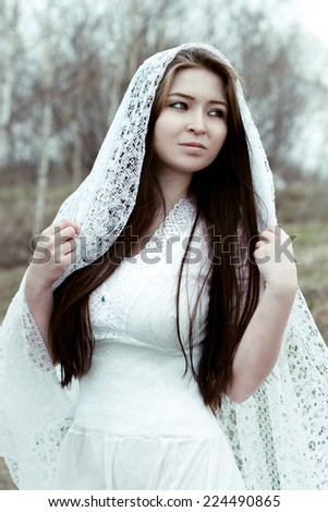 Beautiful innocent woman in white dress