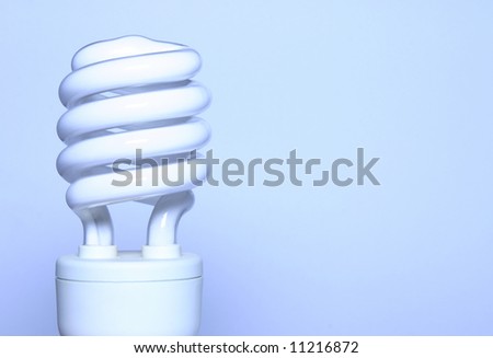 - an energy saving light bulb with room for text; shot in a light tent; blue toning derives from white balance setting \