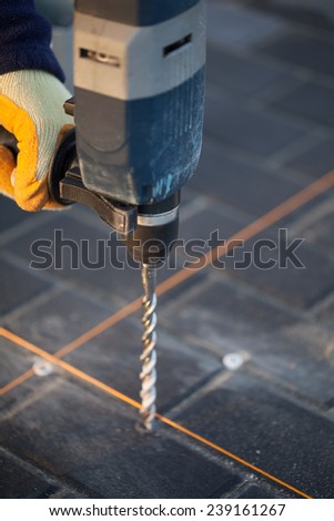 Drilling with hammer drill.