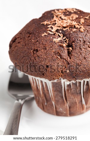 chocolate muffin with dessert fork.