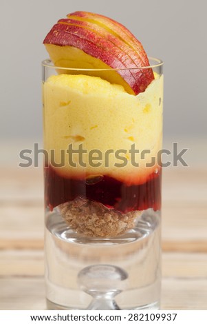 Mini dessert with semolina,  cherry jelly and apple.