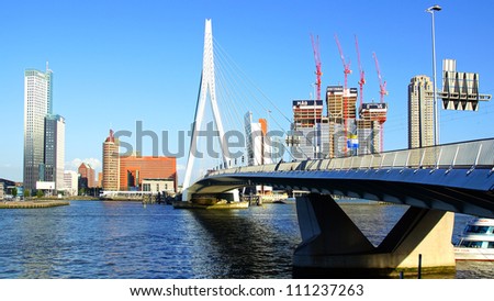 ROTTERDAM, HOLLAND - AUGUST 02: Panoramic view over Erasmus Bridge and Rotterdam port. Erasmus Bridge is one of the icons of Rotterdam on August 02, 2012 in Rotterdam, Holland.