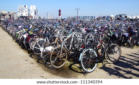 AMSTERDAM, HOLLAND - AUGUST 01: Amsterdam Central station. Many bicycles parked in front of the Central station on August 01, 2012 in Amsterdam, Holland.