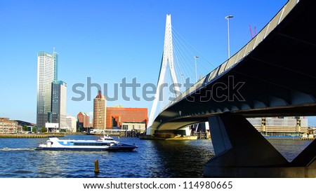 ROTTERDAM, HOLLAND - AUGUST 02: Panoramic view over Erasmus Bridge and Rotterdam port. Erasmus Bridge is one of the icons of Rotterdam on August 02, 2012 in Rotterdam, Holland.