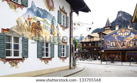 Oberammergau, Germany-June 10: Unique Houses. Houses Are Painted The Religious Themes.Some Of The Houses Are Painted With Scenes From Little Red Riding Hood And Ect;June 10,2012 Oberammergau,Germany