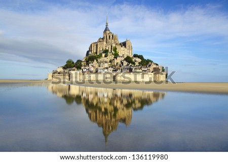 MONT SAINT-MICHEL, FRANCE - AUGUST 12: Mont Saint-Michel with reflection on August 12, 2012 in Mont Saint-Michel, France.  Mont Saint-Michel are part of the UNESCO list of World Heritage Sites